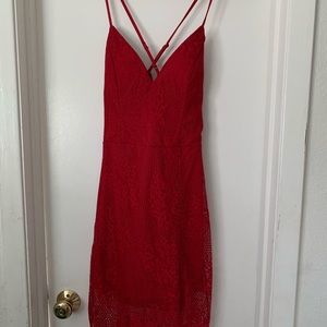 A beautiful red lacy dress that’s never been worn.